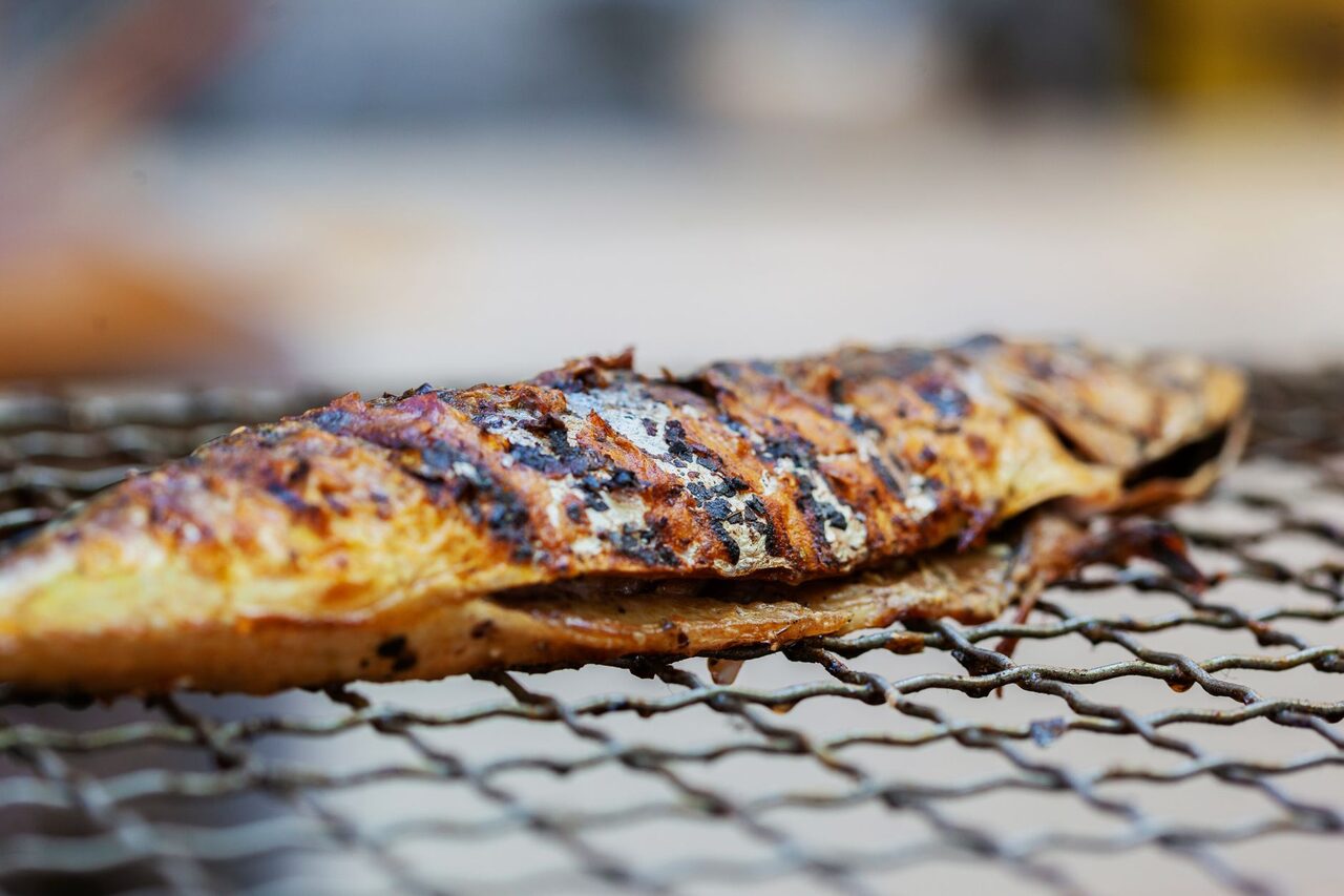 A whole fish on the grill, close up